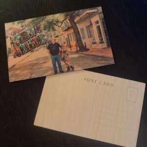 Personalized wooden postcard printed in full color with a couple's vacation photo and a Welcome to New Orleans greeting, shown with the engraved postcard back